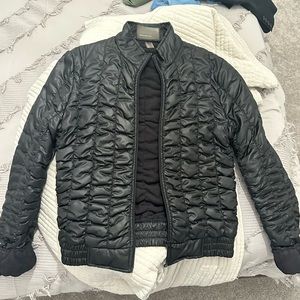 thin black puffer jacket from mango. worn only a few times. great quality